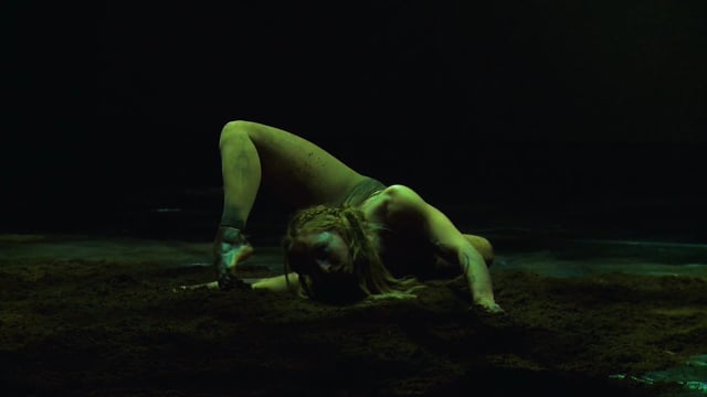 A photo of performer Eloise Currie mid-contortion during her performance of Imprint.