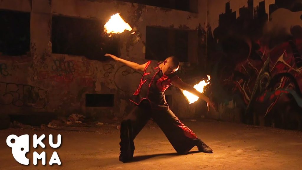 A photo still from a video from Kuma Films of a fire dancer.