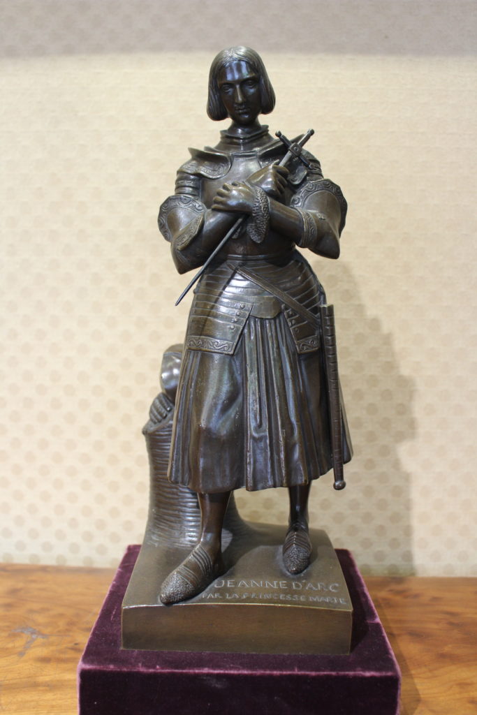 A photo of a statue, approximately one foot high, of Joan of Arc by Marie d'Orléans.