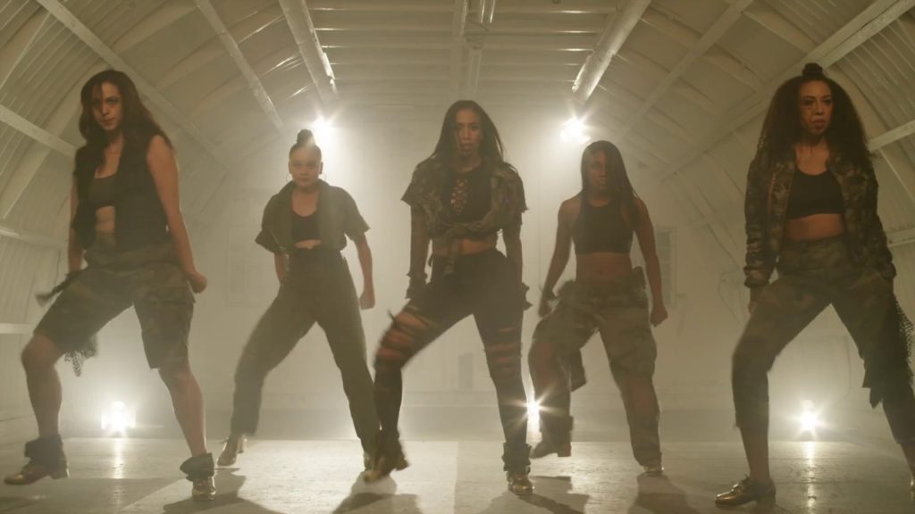 A photo still of the five female dancers of Syncopated Ladies in the Like a Boy video.