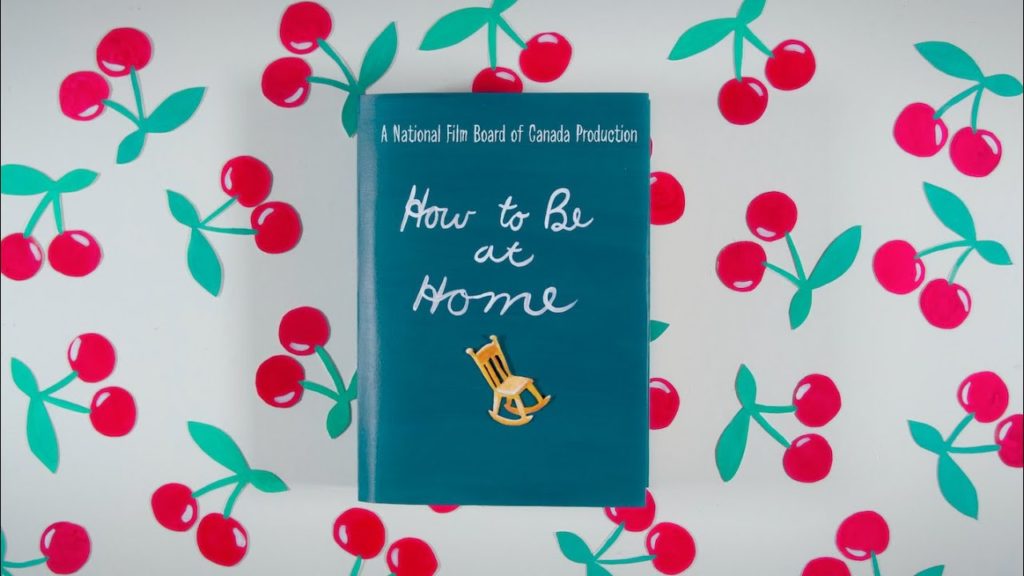 An animated image of a book with the title How to be at Home on the cover with cherries painted on the wall behind.