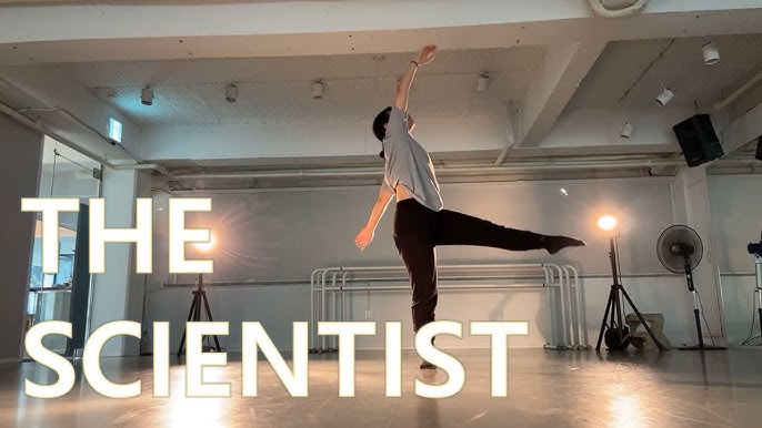 A photo still from the video for The Scientist by the G.NI Jazz Dance.