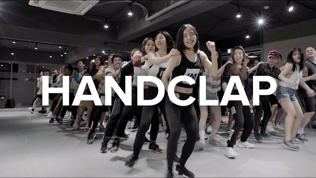 A photo still from the video Handclap by 1Million Dance, with choreography by Lia Kim and May J Lee.