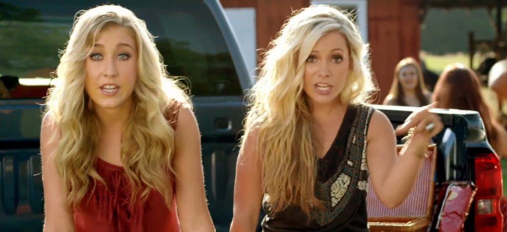A photo still of Maddie & Tae from the music video of Girl in a Country Song