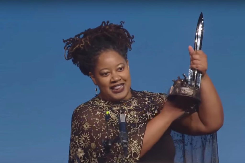 A photo of author NK Jemisin accepting an award.