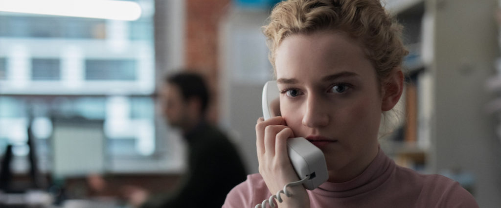A photo still from The Assistant of actress Julia Garner on the phone.