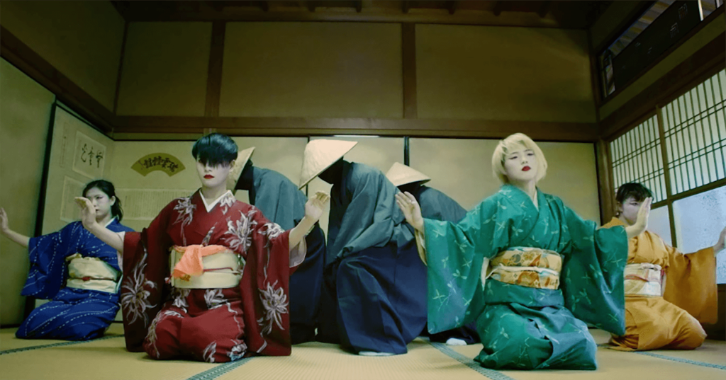 A photo still from the video Kimono by Strawhatz