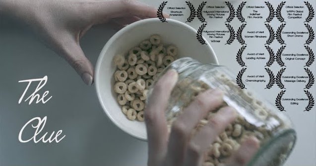 A photo still from the short film The Clue. The photo is a close up of two hands pouring Cheerios into a bowl.