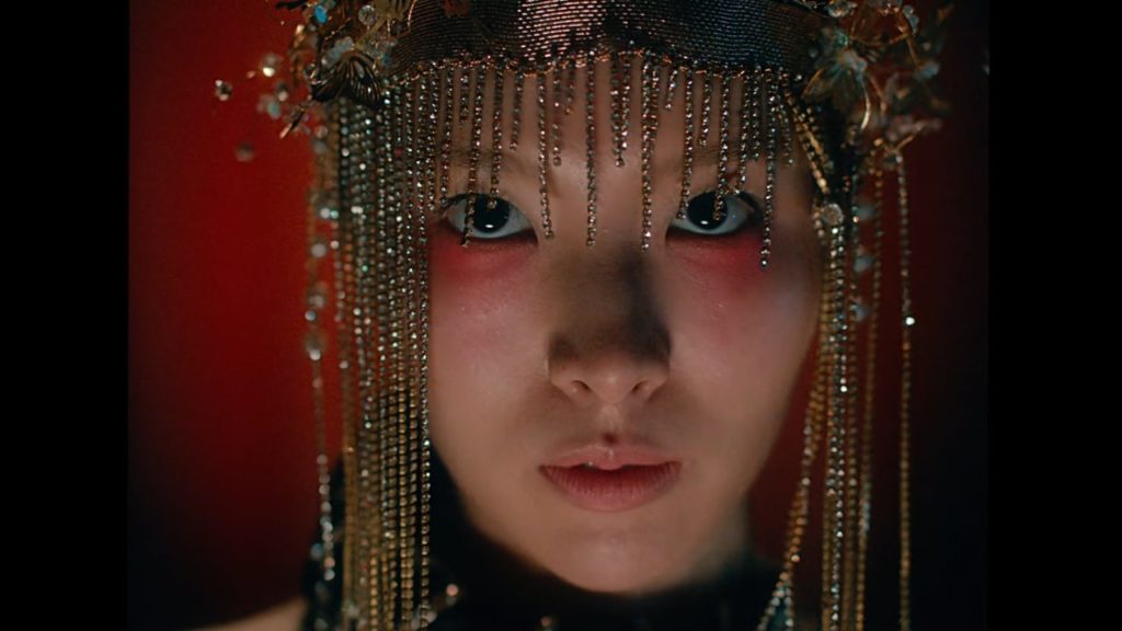A close up of singer Lim Kim from the music video for Yellow
