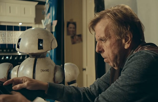 A photo still from the short film This Time Away of lead actor Timothy Spall and the small robot who becomes his character's companion.
