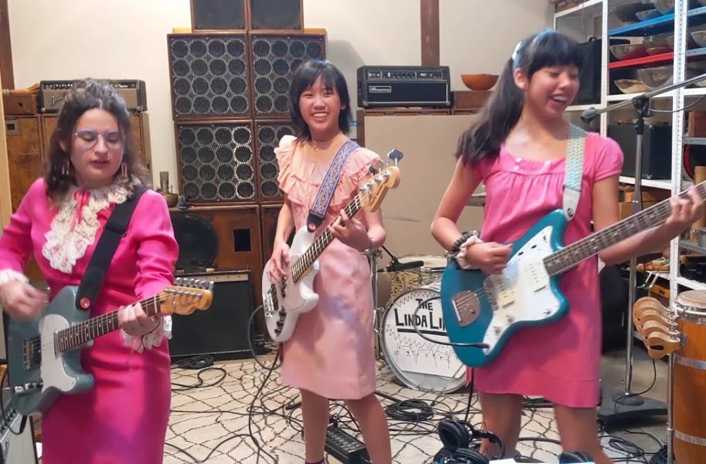 A photo of the Linda Lindas from their music video for Claudia Kishi.