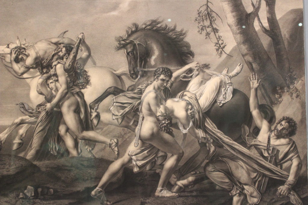 A close up photo of the chalk drawing by Angélique Mongez. The drawing is black and white, and depicts Theseus and Pirithoüs saving two women who had been abducted.
