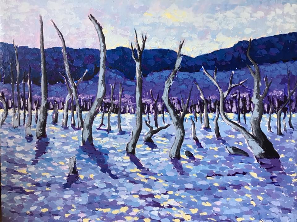 An image of a painting by Souphaluck phongsavath. The painting shows a forest of bare trees in winter with snow on the ground and an icy sky.
