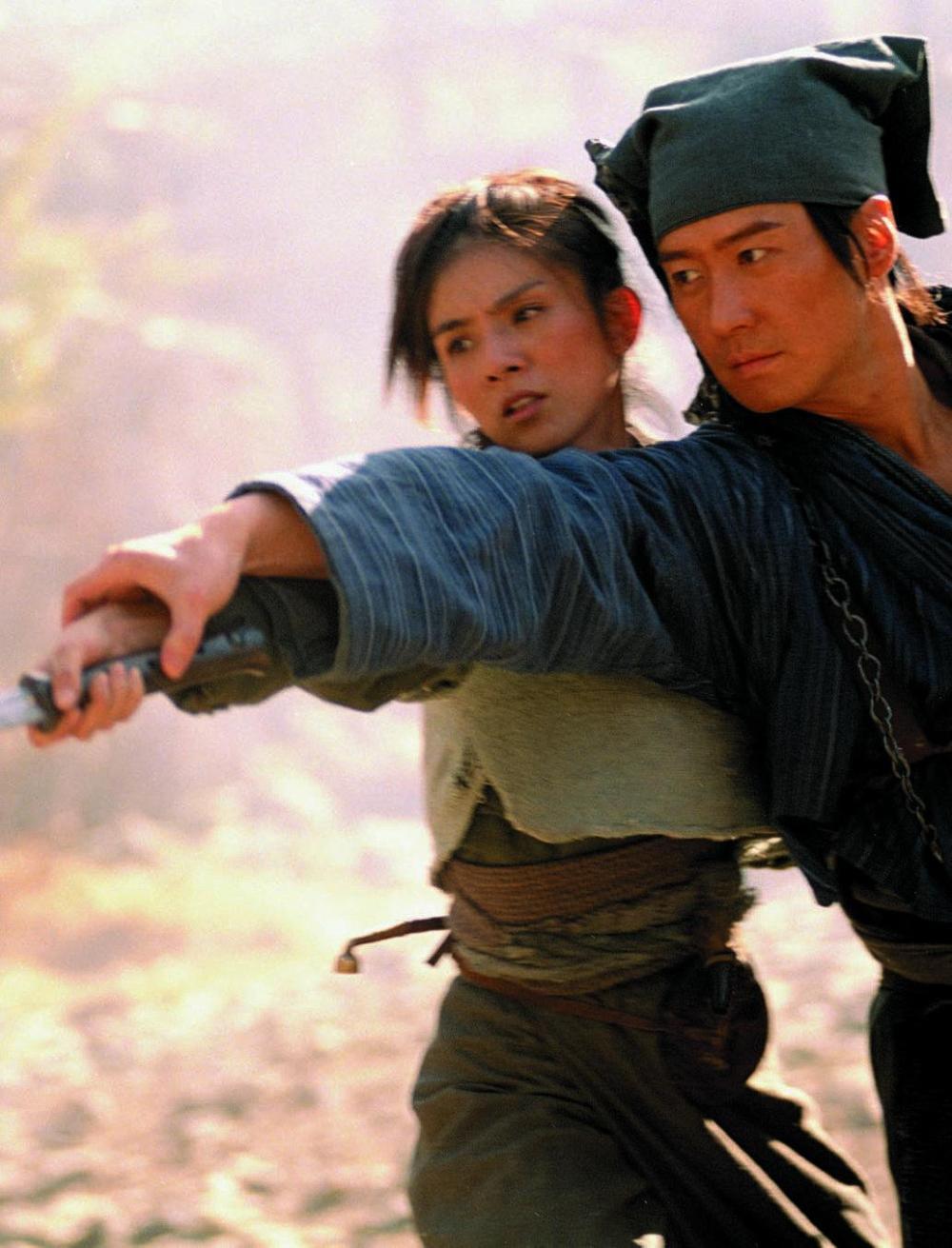 A photo still from the wuxia film Seven Swords. It shows two characters practicing with a sword.