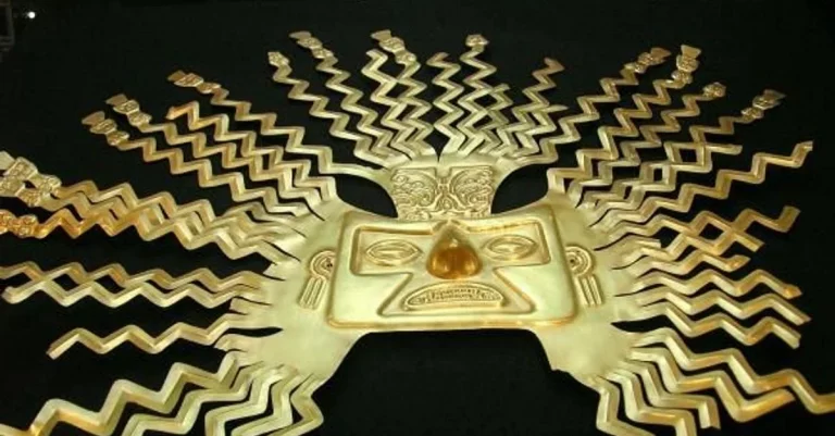 A photo of a gold mask of the Sun God Inti