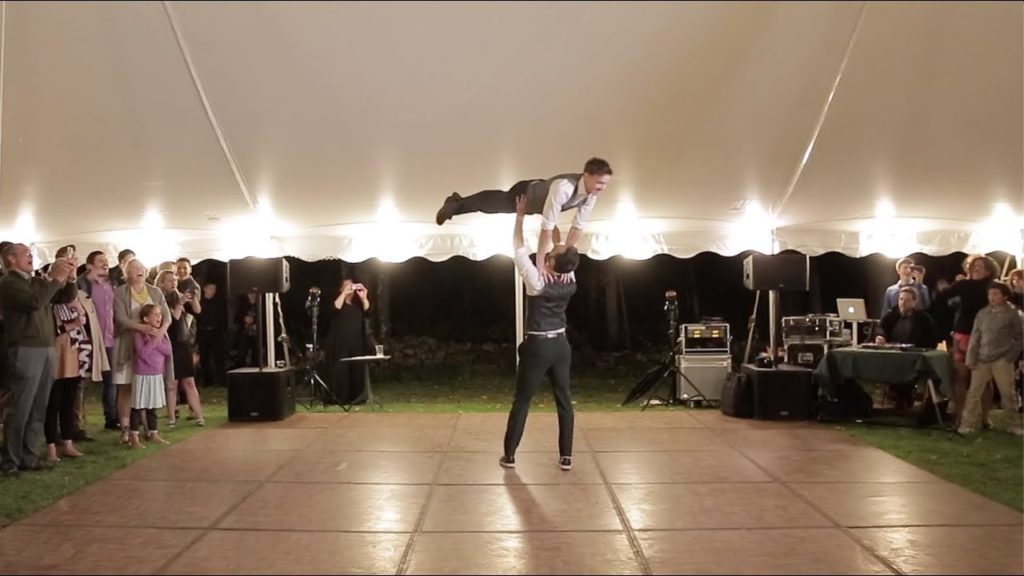 A photo of Noah and PJ on a dance floor doing the Dirty Dancing lift.