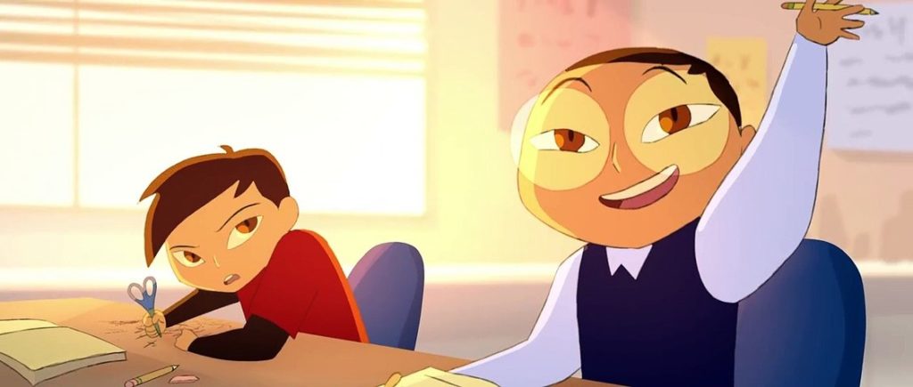 An animated still from The Twins by Michelle Tang. It shows two young boys sitting at a desk in a classroom. One has his hand up, looking at the teacher, while the other is glowering at his brother.