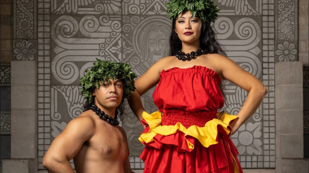 A photo of Chief Laiuni and Malia in their traditional hula outfits, posing side by side and into the camera.