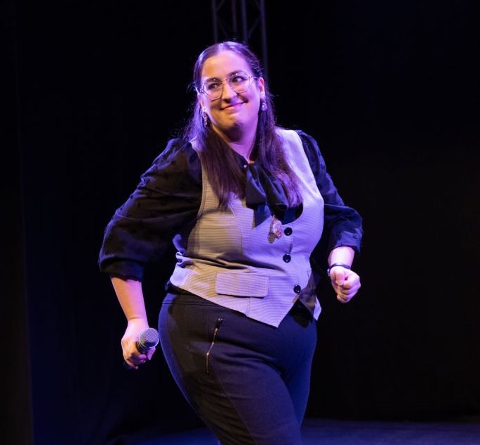 A photo of Nicola Macri onstage, mid-performance.